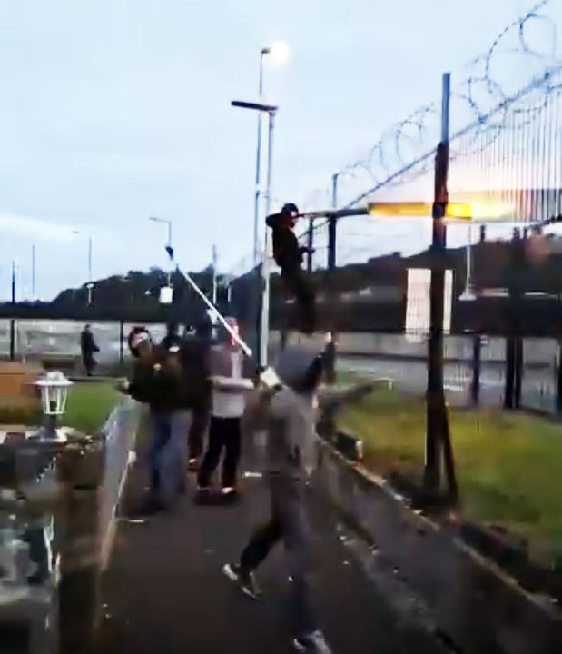 Videos circulating online show people, some of them with their faces covered, fighting in the street.